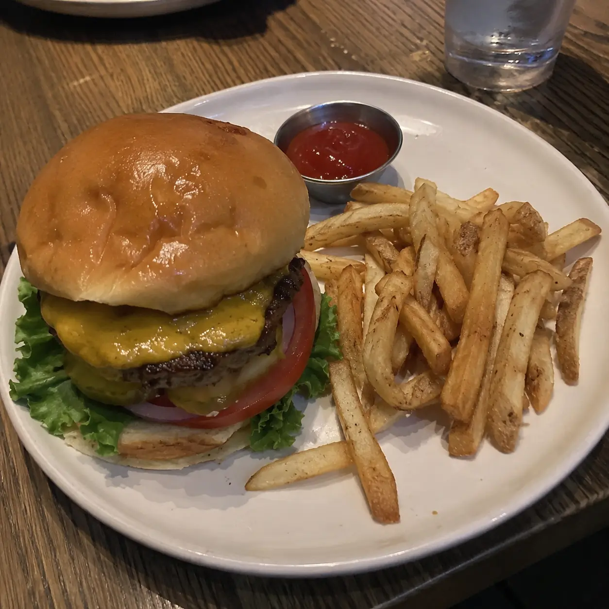 Original phone photo of a cheeseburger and fries